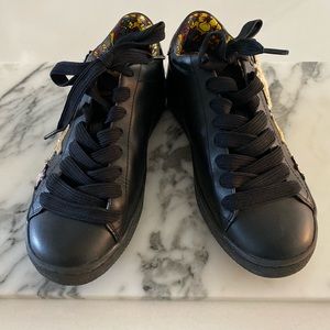 Coach sneakers with patches.